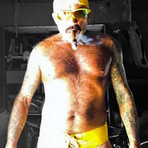 STINKYDONGER smoking a cigar in a YELLOW LACE-UP JOCKSTRAP