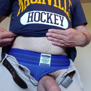 My uncut cock and balls hanging out of my shorts