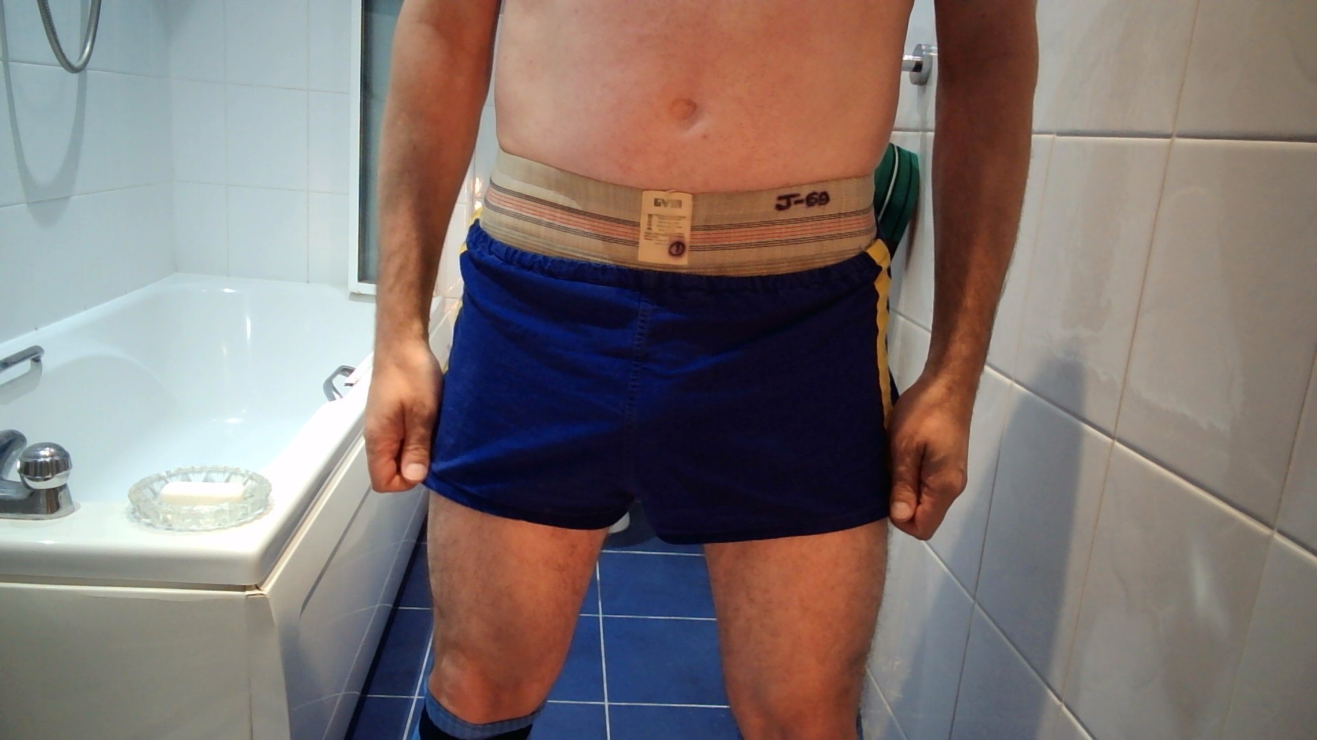 A close-up of the shorts and the filthy waist band