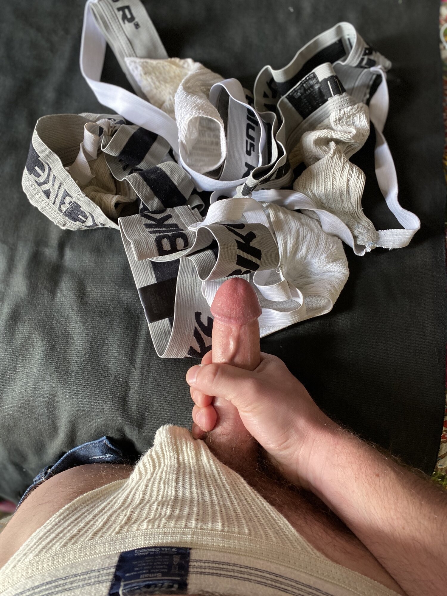 Blowing my load on a pile of dirty and ripe straps