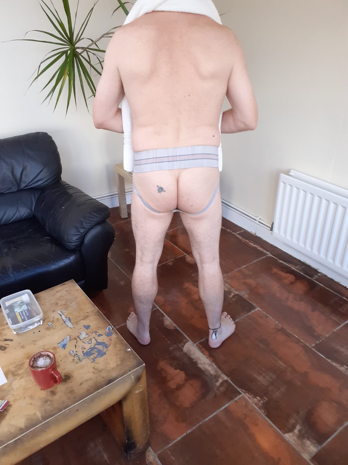 Rear view of the cum and piss stained grey GYM jockstrap before I enter the sling room of the sauna/bath house.