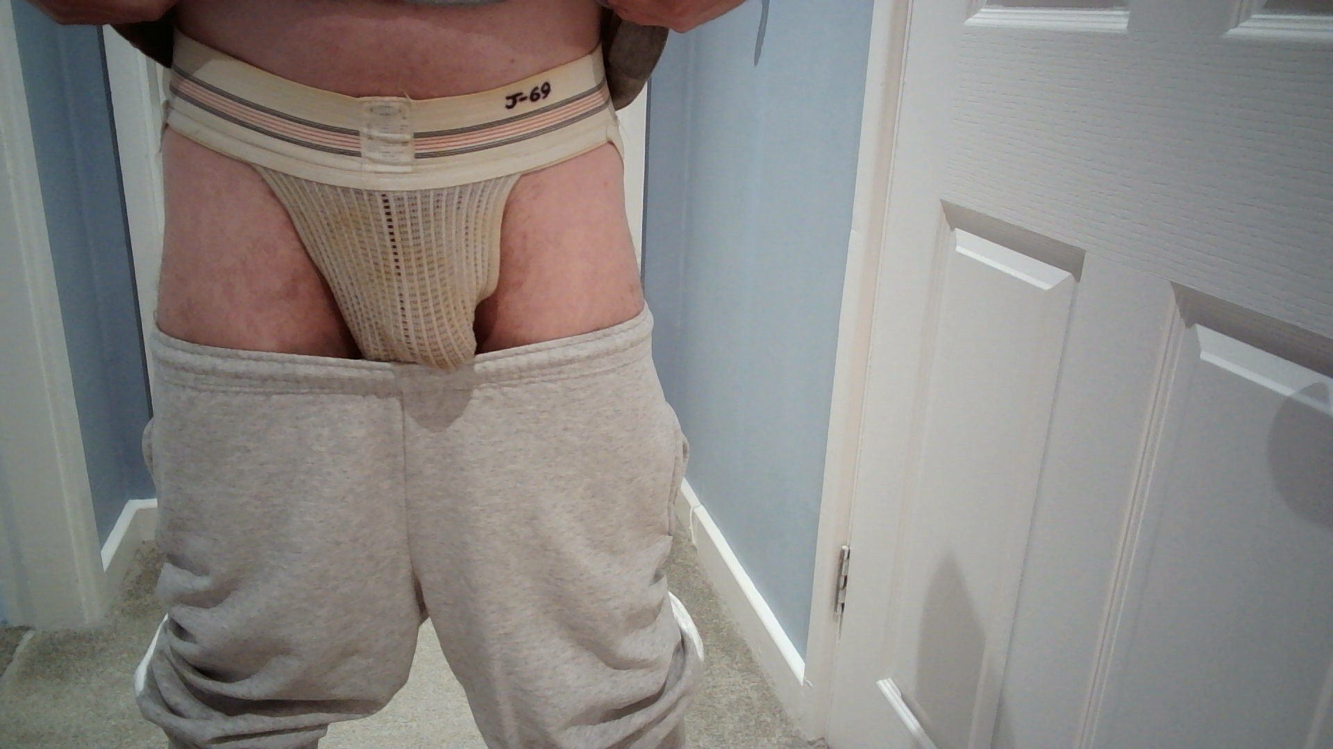 The contrast between the ultra clean jogging bottoms/sweat pants and the filthy, ripe and rank Bike #10 jockstrap