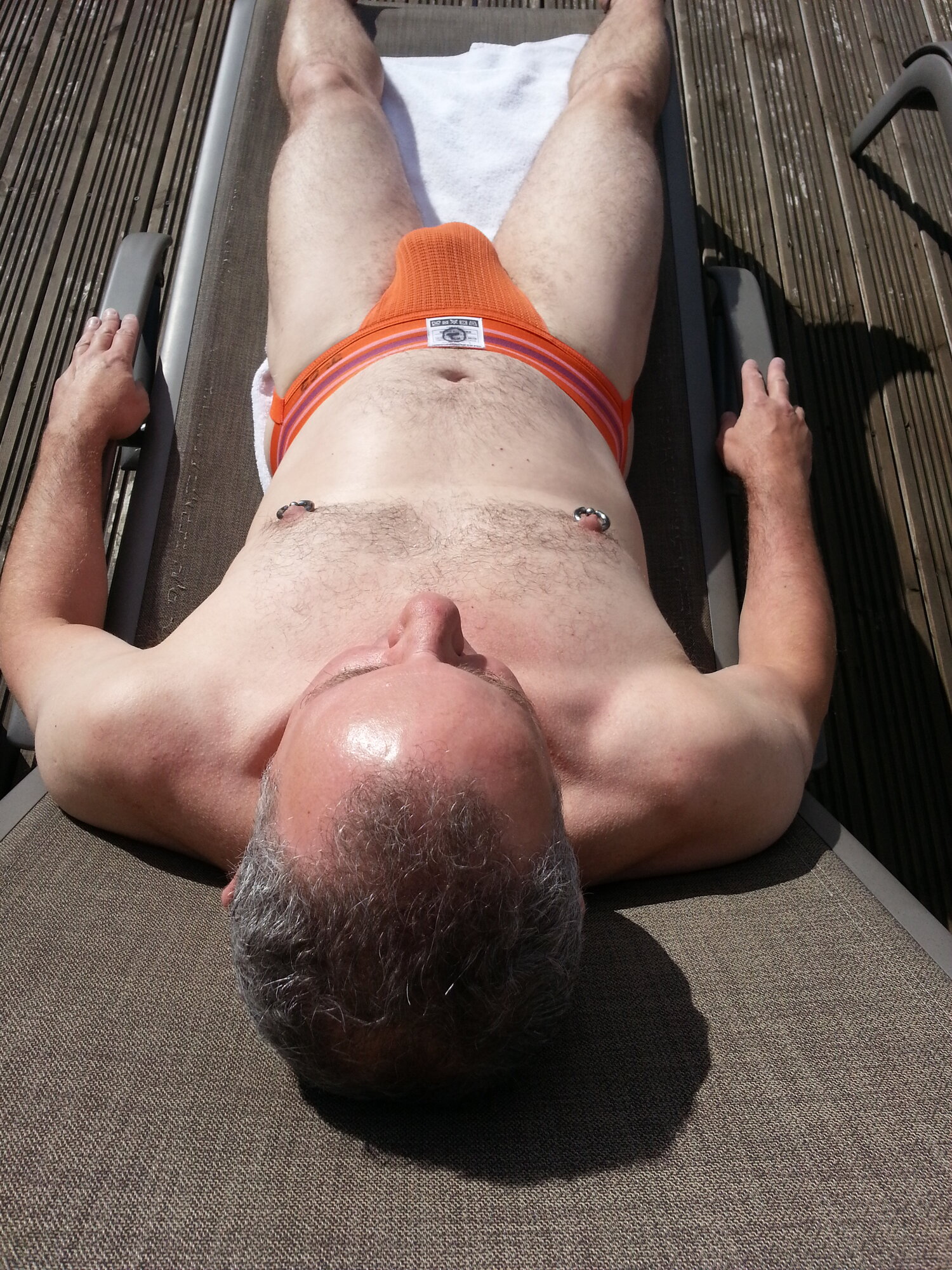 Top view of me sunbathing in orange Jock Mail #2